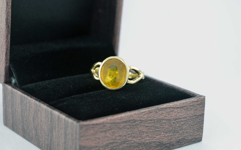oval gemstone ring in panchdhatu metal for vedic astrology jupiter planet November birthstone pukhraj Natural yellow sapphire