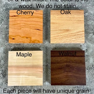May include: Four wood samples, each with a different wood grain and color: cherry, oak, maple, and walnut. The wood is finished with a natural oil and wax finish. Each piece will have unique grain variation.