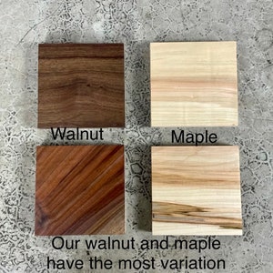 May include: Close-up of four wood samples, two walnut and two maple. The samples show the natural grain and color variations of the wood. "Our walnut and maple have the most variation" is written below the samples.