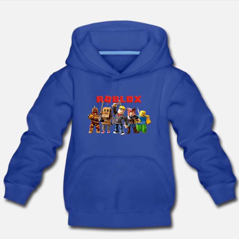 May include: A royal blue hooded sweatshirt with the word "ROBLOX" printed in red letters. The sweatshirt features a graphic of five cartoon characters from the popular online game Roblox.
