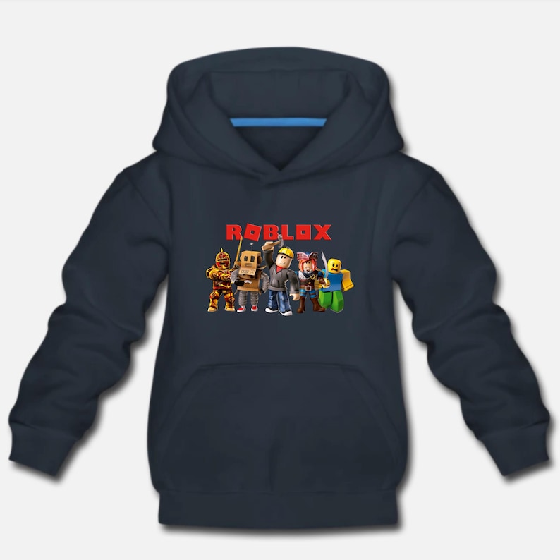 May include: A dark blue hooded sweatshirt with the word "ROBLOX" in red letters on the front. The graphic features a group of cartoon characters from the popular online game.