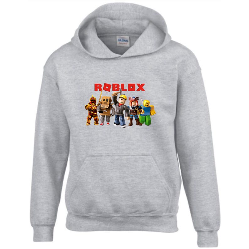 May include: Gray hooded sweatshirt with a red "ROBLOX" logo and a graphic of five cartoon characters.