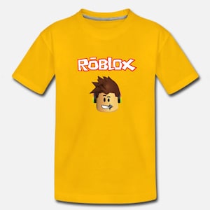 Puede incluir: Camiseta amarilla con un logotipo de Roblox y un personaje de dibujos animados de Roblox con auriculares.
