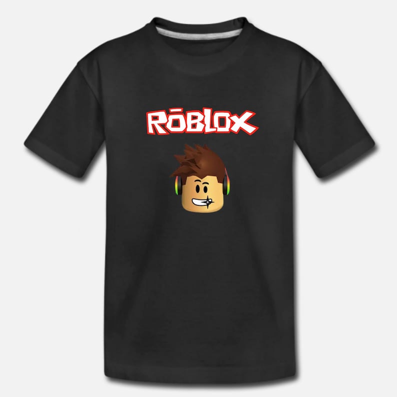 Puede incluir: Camiseta negra con un logotipo rojo "ROBLOX" y un personaje de dibujos animados con auriculares.