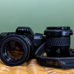 Analog camera MINOLTA DYNAX 404si film camera with | 35-70 mm f/3.5-4.5 | + | 28-80 mm f/ 3.5-5.6 |