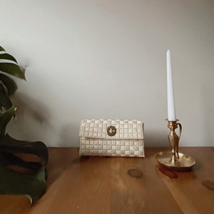 Vintage cream woven clutch