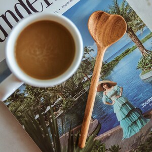 Custom engraved wooden spoon with heart design for bridal shower gifts.