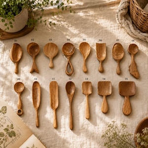Handcrafted teak mini wooden spoons and spice scoops featuring unique handles, including fish, loop, and shovel designs, numbered for easy custom selection.