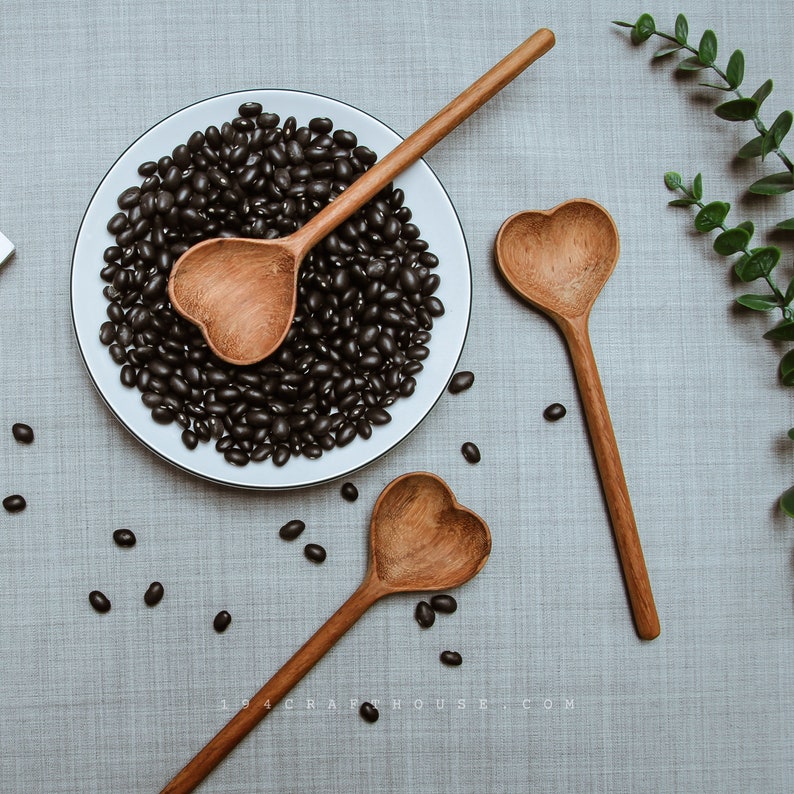 Handmade wooden spoon with heart-shaped design, perfect for bridal gifts.
