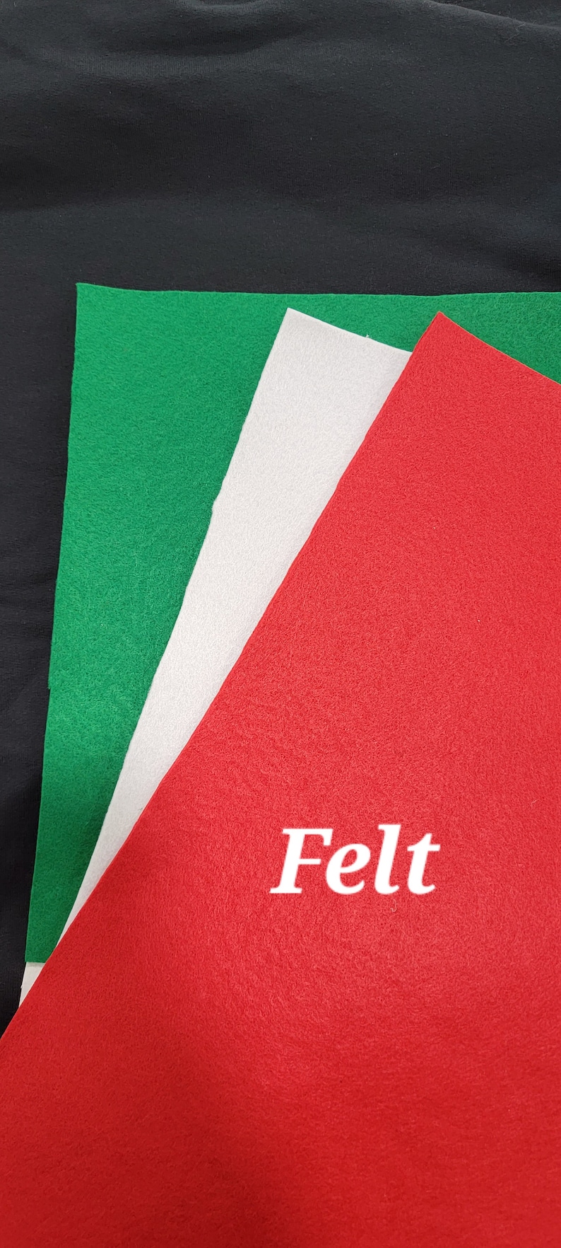 May include: Three sheets of felt in red, white, and green. The red sheet has the word "Felt" printed in white.