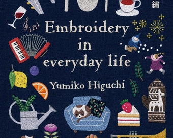 May include: A book cover with the title "Embroidery in everyday life" by Yumiko Higuchi. The cover features a variety of colorful embroidered images, including a teapot, a cup of tea, a plane, a lemon, a watering can, a cat, a croissant, and a trumpet. The book is published by Bunkasha.