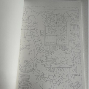 May include: A detailed black and white illustration of a coloring book page. The scene depicts a cozy room with cartoon animals, including cats and rabbits, engaged in various activities. A ladder, books, and a window with a tree are also visible.