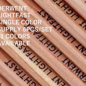 May include: Close-up of a set of wooden pencils with the text "Derwent Lightfast Single Colour Supply 6pcs/set 31 Colours Available" printed on them.