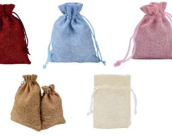 May include: Five drawstring bags made of burlap fabric in various colors. The bags are red, blue, pink, brown, and beige.