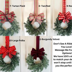 May include: A collection of decorative wreaths with various ribbon styles. Options include tartan plaid, tan/red, red buffalo check, large polka dots, and burgundy velvet. Each wreath features a green base with a snowy effect.