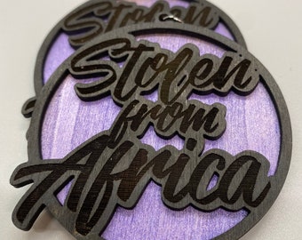 Stolen From Africa Earrings (Black on Purple)