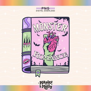 Puede incluir: Un libro rosa y verde con el título "Monster Romance" y una mano verde sosteniendo un corazón rojo. El libro tiene un marcapáginas en forma de corazón.
