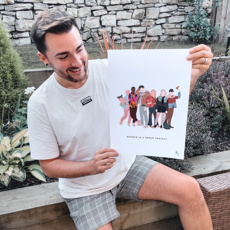 May include: A white poster with a group of cartoon people in various colors and poses. The text on the poster reads "Growth is a group project".