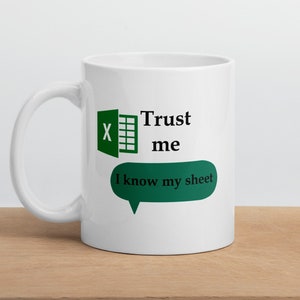 May include: White ceramic mug with a green Microsoft Excel logo and the text "Trust me I know my sheet" in a speech bubble.