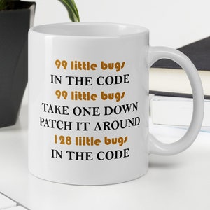 May include: White ceramic coffee mug with a black and brown design. The mug features the text "99 little bugs in the code, 99 little bugs, take one down, patch it around, 128 little bugs in the code".