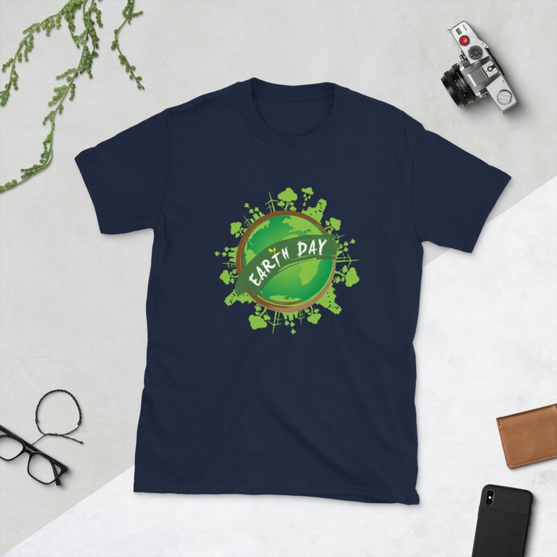 May include: Navy blue t-shirt with a green graphic of the Earth with the text "Earth Day" on it.