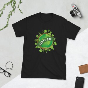 May include: Black t-shirt with a green graphic of the Earth with the text "Earth Day" on it.