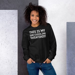 May include: Black sweatshirt with white text that reads "This is my dog cuddling sweatshirt".