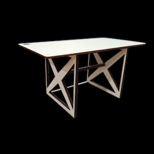 May include: A white wooden desk with a geometric, X-shaped base. The desk has a simple, modern design.