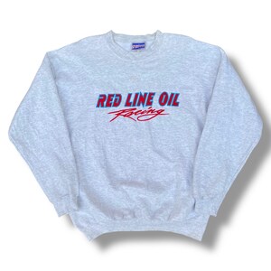 May include: A gray sweatshirt with a red and blue embroidered logo that says "Red Line Oil Racing".