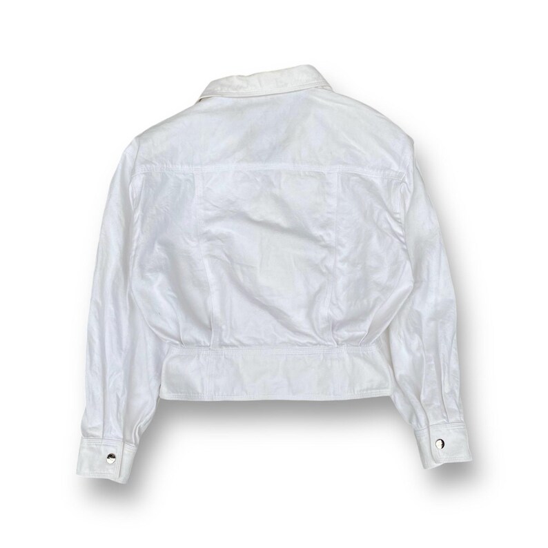May include: White long-sleeved button-up shirt with a collared neckline and a cropped hem.