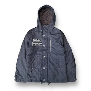 May include: A dark gray hooded jacket with a zipper closure and multiple pockets. The jacket has a fleece lining and a patch with the text "Von Dutch" and "Make Your Dreams Come True".