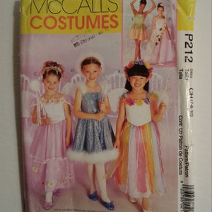 May include: A sewing pattern for children's fairy costumes. The pattern includes instructions for making four different costumes: a pink fairy, a blue fairy, a rainbow fairy, and a green fairy. The pattern is for sizes 7-8-10.