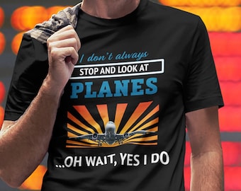 May include: A black t-shirt with a white and blue graphic that says "I don't always stop and look at planes...oh wait, yes I do".