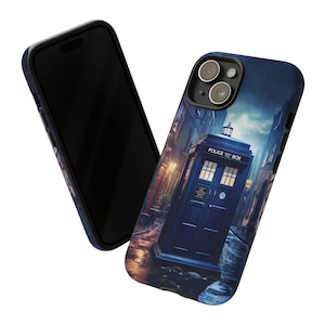 May include: A phone case featuring a blue police box design with the text "POLICE BOX" on the top. The case has a dark blue border and a detailed illustration of a street scene with rain.