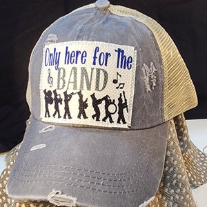 Only here for the Band hat - criss cross ponytail