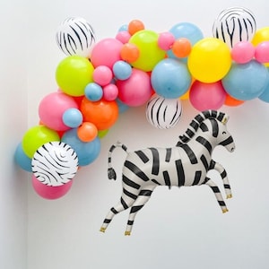 May include: A colorful balloon arch with black and white zebra print balloons and a zebra balloon animal.