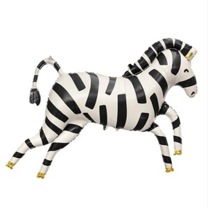 May include: Black and white zebra balloon animal. The balloon is inflated and has a gold colored tail and hooves.