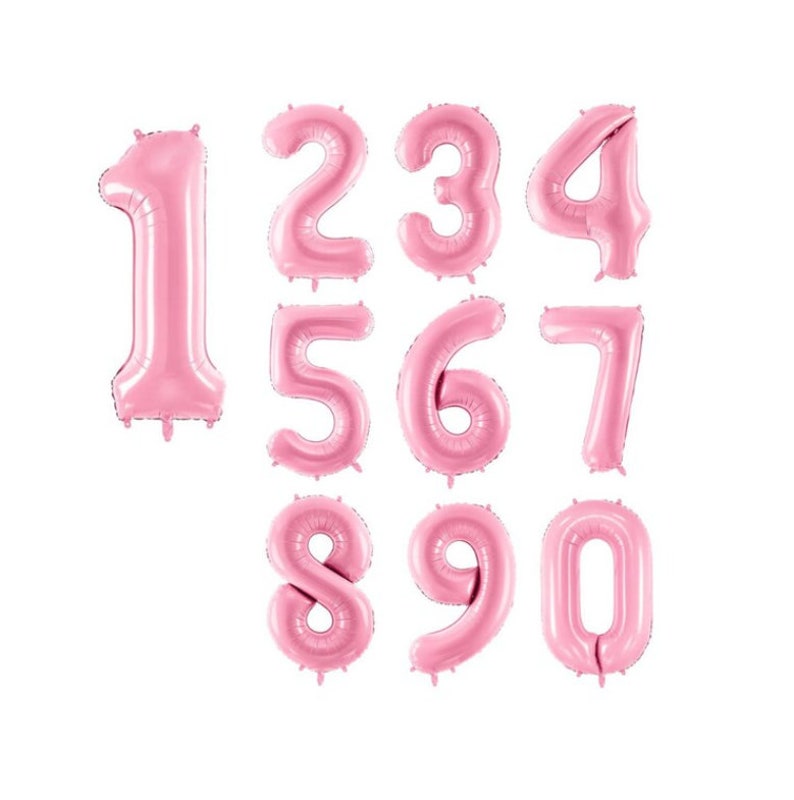 May include: Pink foil number balloons, 1 through 0, for a party or celebration.