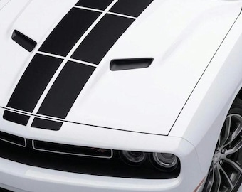 May include: White car bonnet with black racing stripes. The bonnet features two air vents and a front bumper with a black spoiler. The car has a silver wheel.