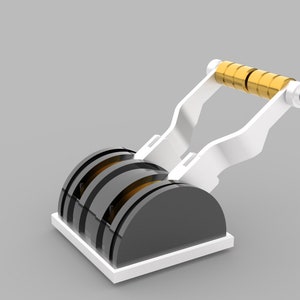 May include: A white and black aircraft engine switch with a gold handle. The switch has two levers that can be moved up and down.