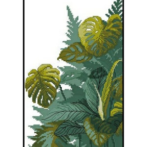 Op de afbeelding: Een kruissteekpatroon met een weelderig groen tropisch gebladerte ontwerp met grote, gedetailleerde bladeren. Het patroon is ingelijst in een zwart frame.