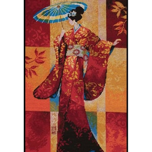 May include: A woman in a red and gold kimono with a blue and white umbrella stands in front of a colorful patterned background.