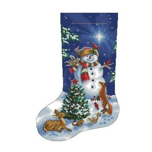 May include: A blue Christmas stocking featuring a snowman, a deer, a fox, and a squirrel. The snowman is wearing a red and white scarf and a green hat. The stocking is decorated with a star and a pine tree.
