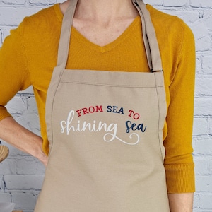 Patriotic apron from sea to shining sea red white and blue embroidered kitchen accessory with pockets and adjustable neck