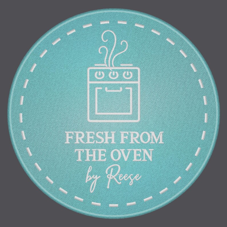May include: A turquoise blue round sticker with a white outline and a white oven icon with steam coming out of the top. The text "FRESH FROM THE OVEN by Reese" is written in white below the oven icon.