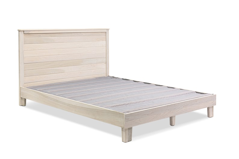May include: A light wood platform bed frame with a slatted headboard. The bed frame has a simple design and is made of solid wood.
