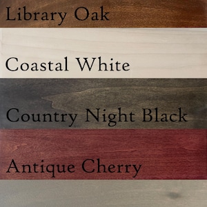 May include: Wood stain color samples showing different shades of brown, white, gray, and black. The samples are labeled with the following names: Aged Walnut, Library Oak, Coastal White, Country Night Black, Antique Cherry, Rustic Grey, and No Stain.