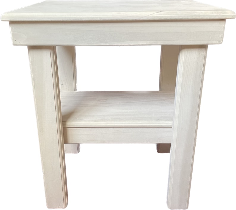 May include: White wooden end table with a shelf. The table has a simple design with straight lines and a smooth finish.