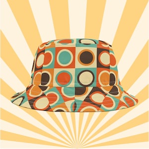May include: A bucket hat with a retro geometric pattern featuring orange, brown, blue, and white circles and squares.