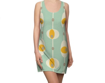 May include: A sleeveless dress with a mint green background and a repeating pattern of yellow and white ovals with gray circles inside.